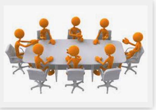 People sitting around conference table